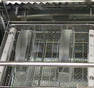 Figure 5: Cleaning in an ultrasonic bath.  Figure 5: Cleaning in an ultrasonic bath.